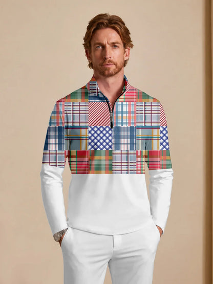 Man wearing a white and multi-colored patchwork plaid performance golf quarter-zip pullover.